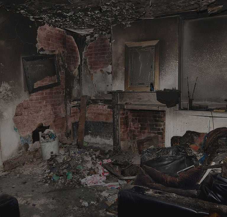living room with significant fire damage